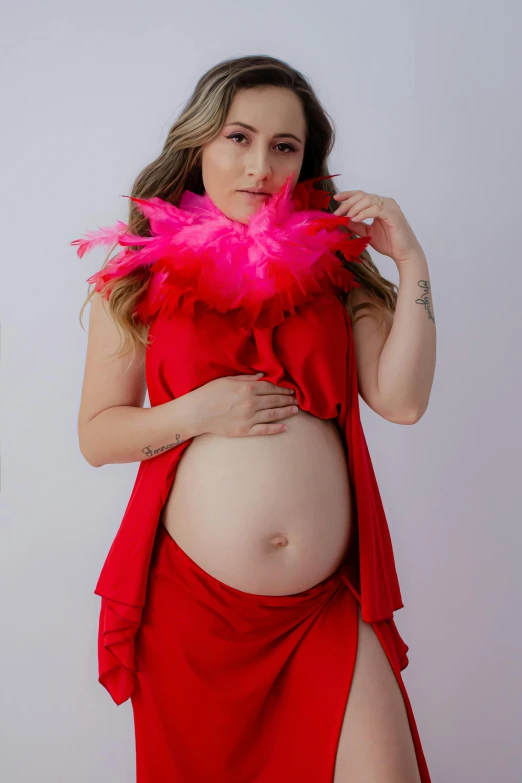 pregnant woman wearing a red outfit with big 