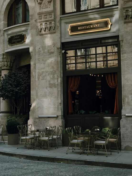 a street side restaurant with tables set up outside