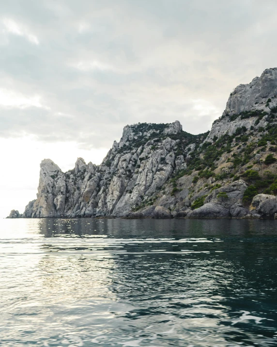 there is a very large rock formation out at sea