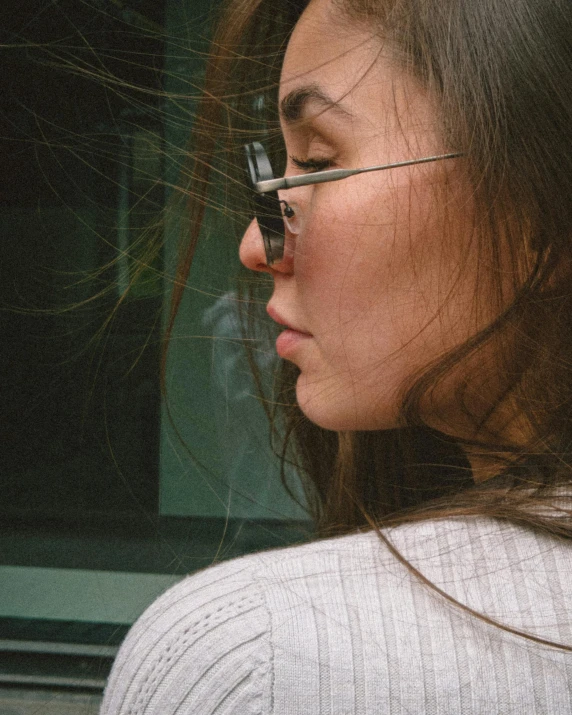 a woman holding a cellphone to her face