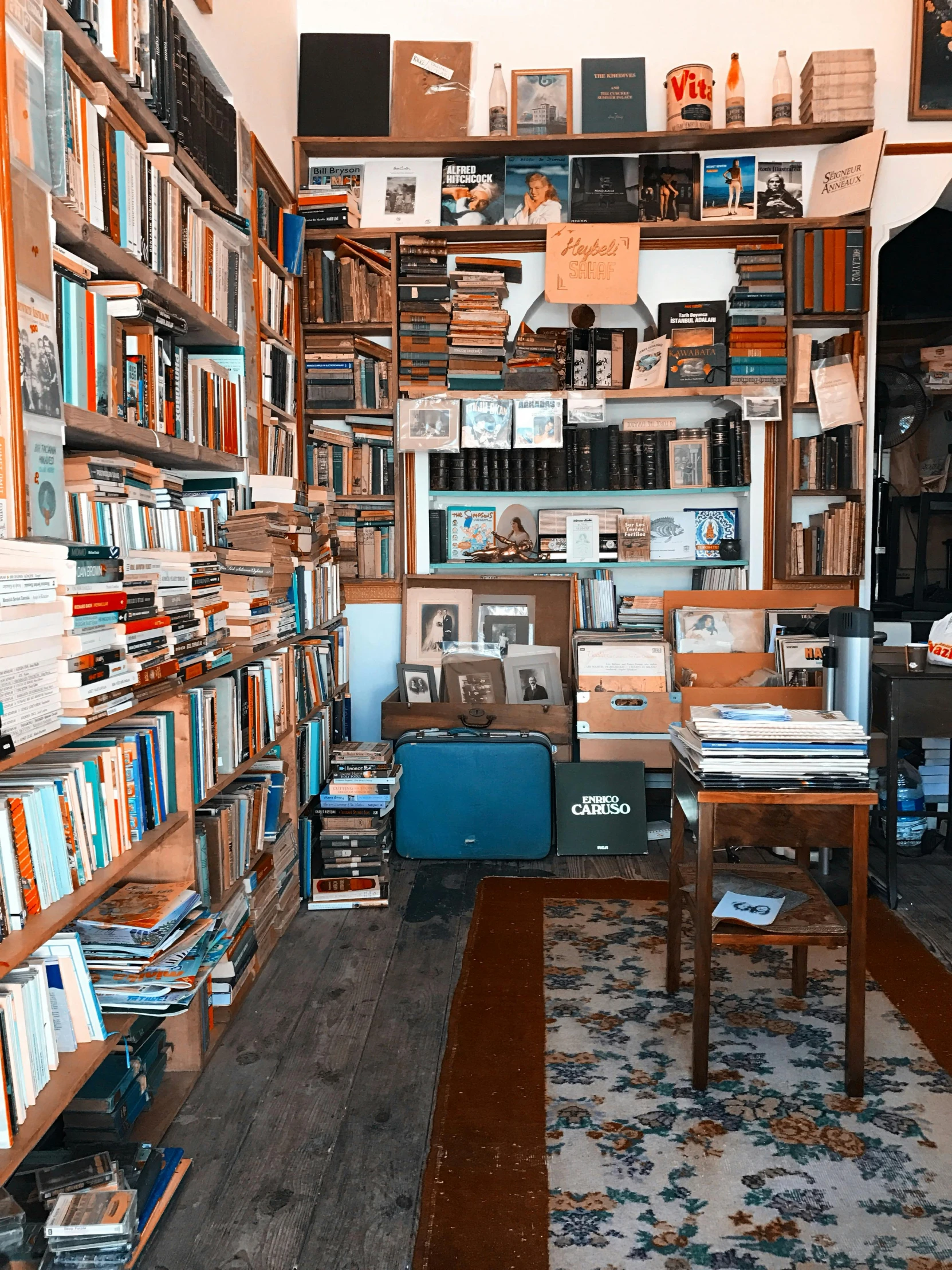 a room with lots of books on shelves in it