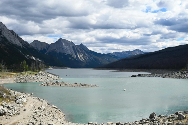 there are some people swimming in a lake