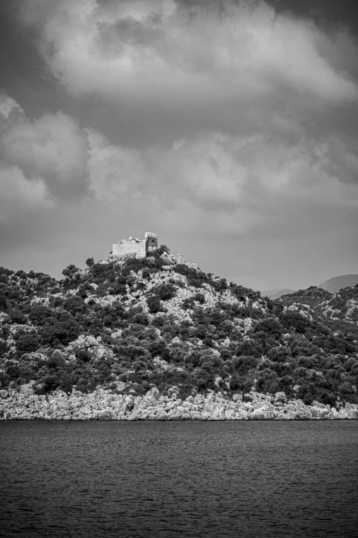 an old castle sits on top of a small island