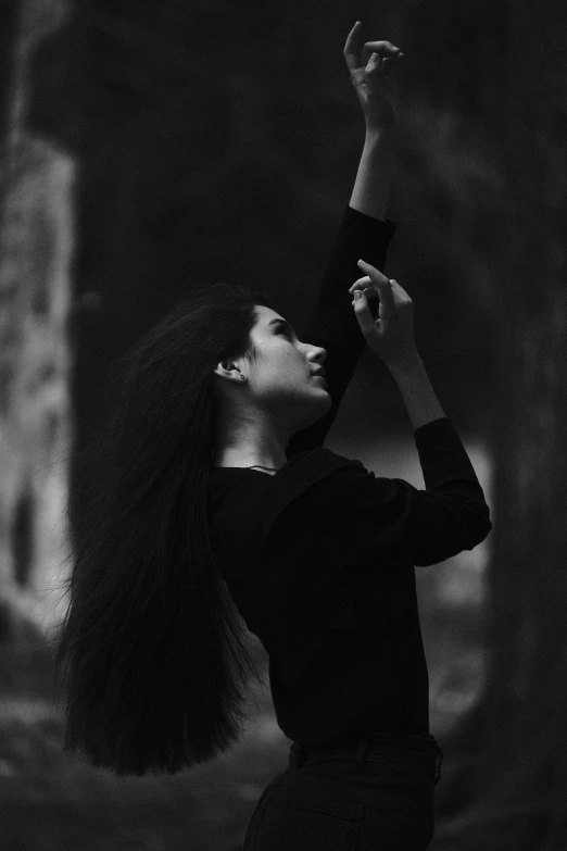 a black and white po of a person holding a tennis racquet