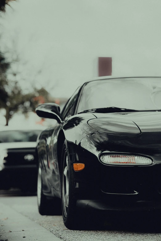 two cars side by side on the road