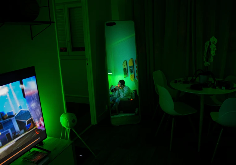 a television that is illuminated with green lights