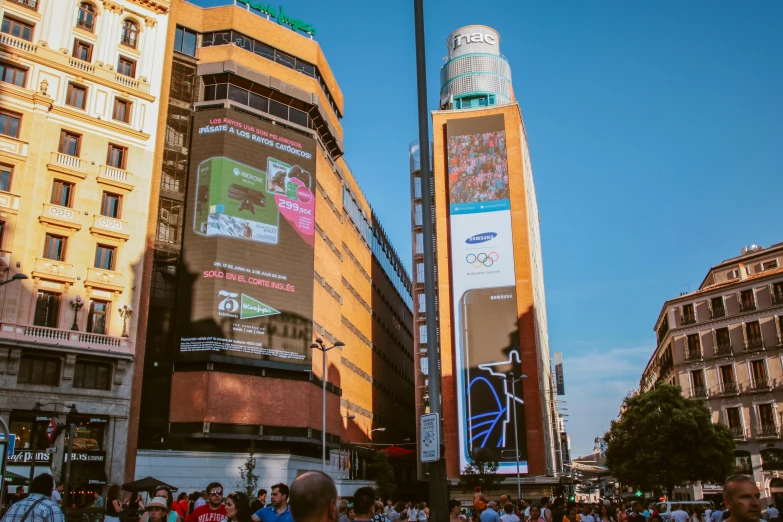 several people walk on a busy city street