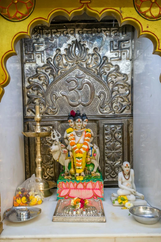 colorful statue on display in front of decorative wall