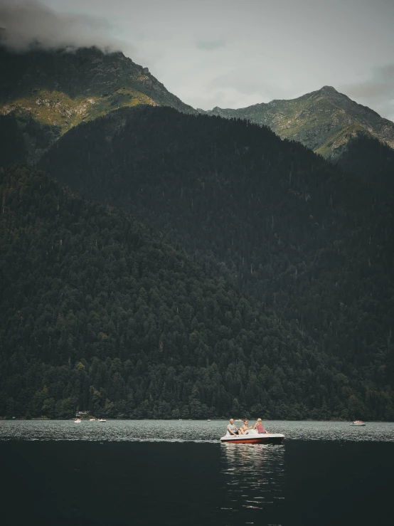 two boats floating on top of the water