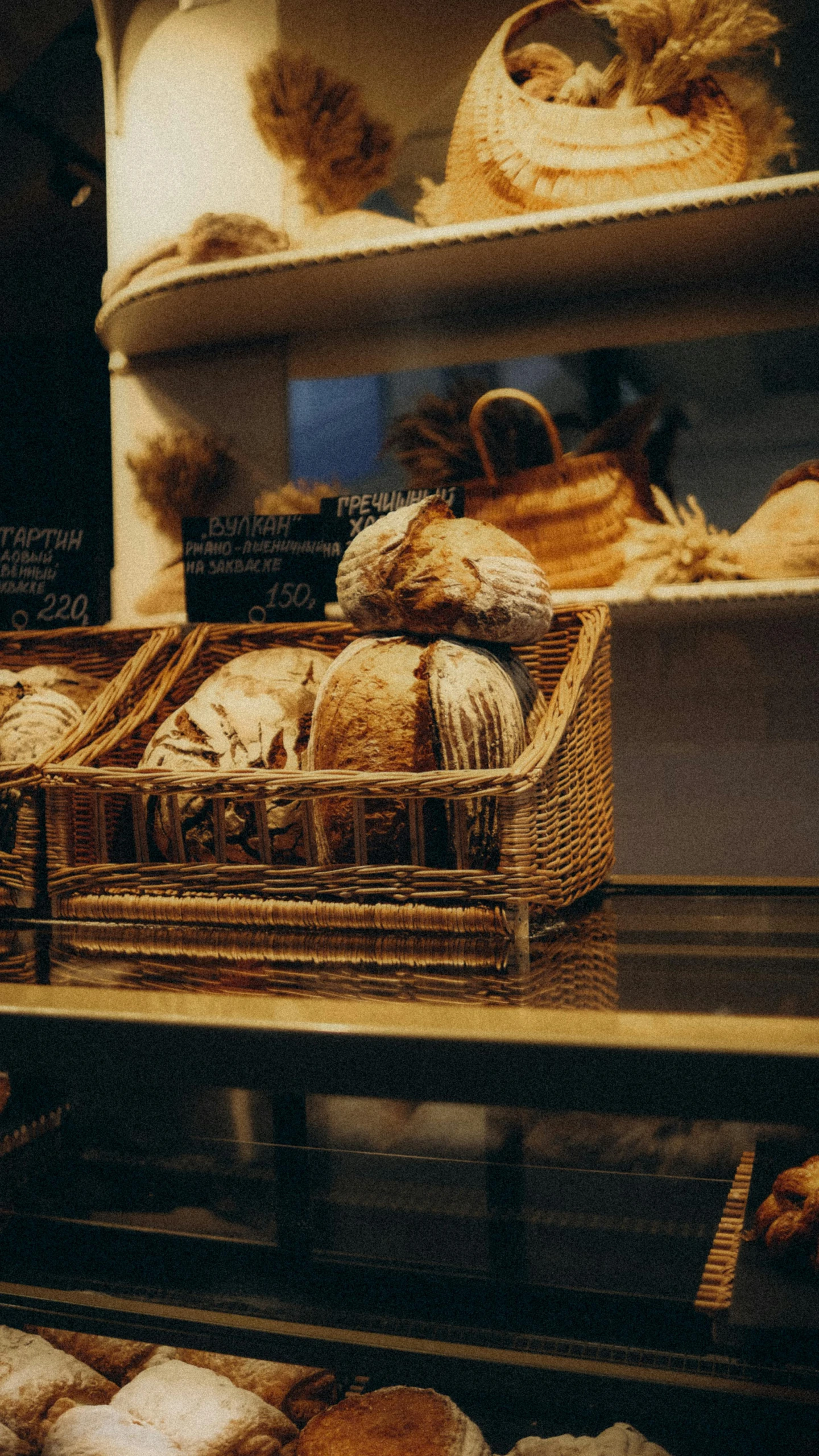 a window display with several types of bread