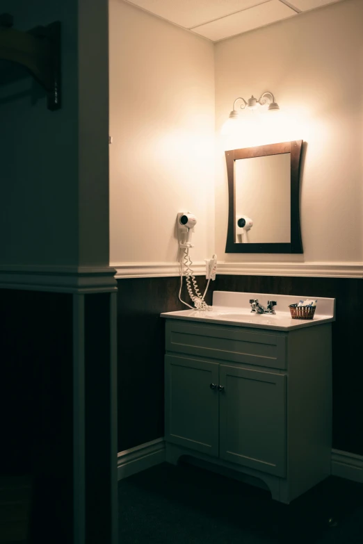 a bathroom sink sitting next to a mirror