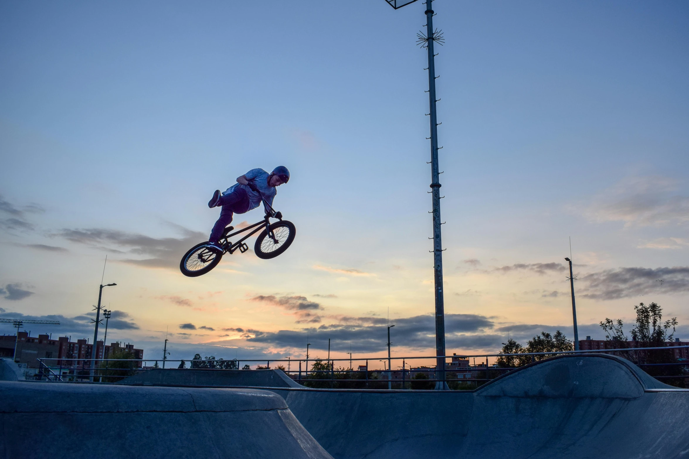 a person on a bike jumping in the air