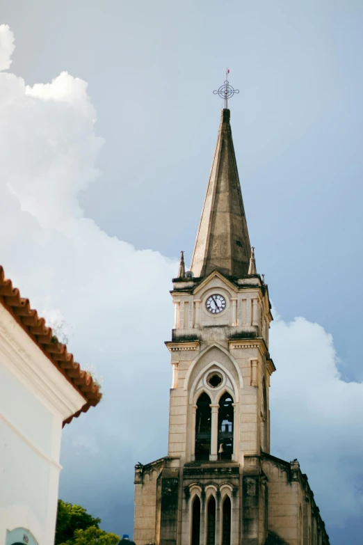 a tower with a clock on it that has a sky background