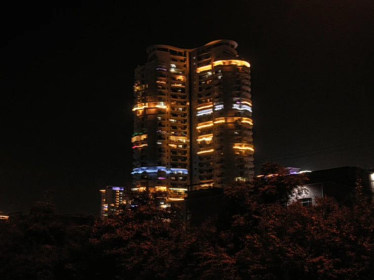 the night skyline reflects the bright lights of buildings