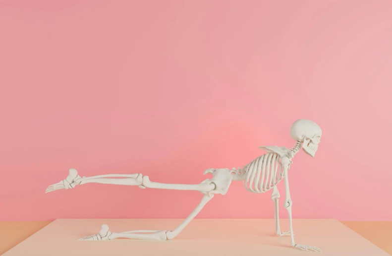 a skeleton in a pink room leaning to the side