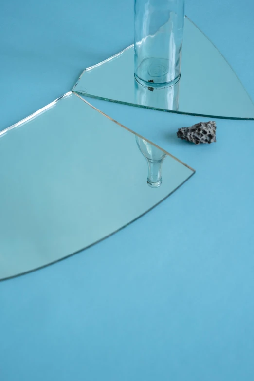 two glasses on a glass table with a silver tray beside it