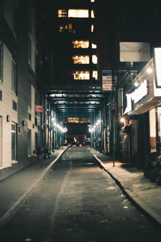 a deserted street at night with no cars