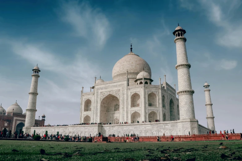 a large building with two big domes and pillars