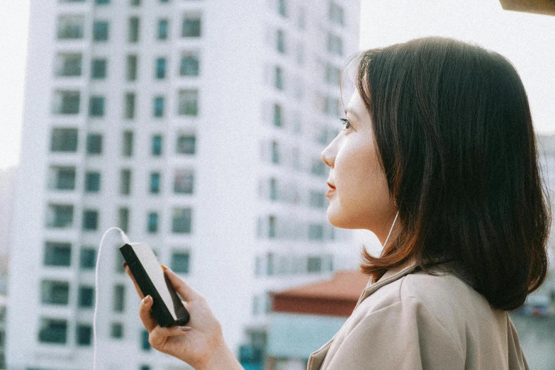 a woman is looking at her cell phone