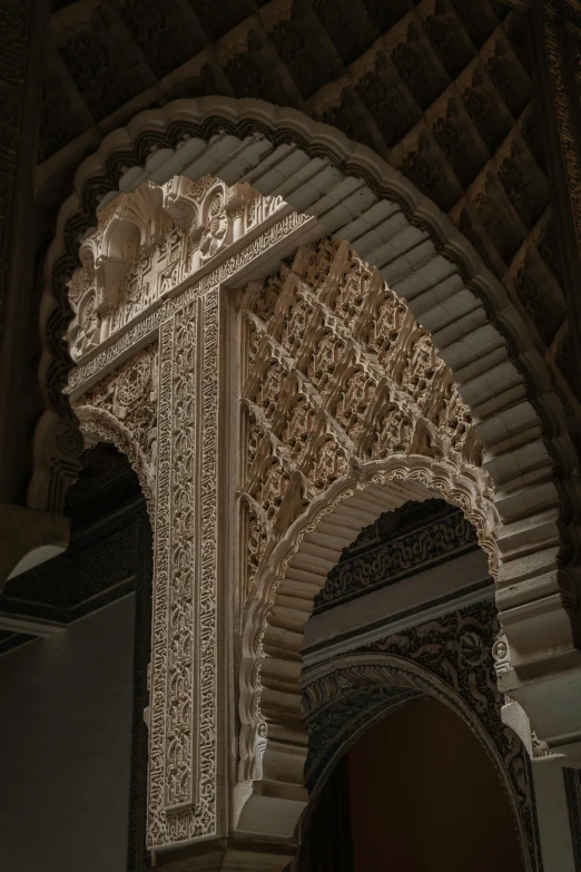 arches with carved stone on them are the focal point of this po