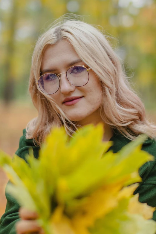 a woman is holding a vase filled with yellow flowers