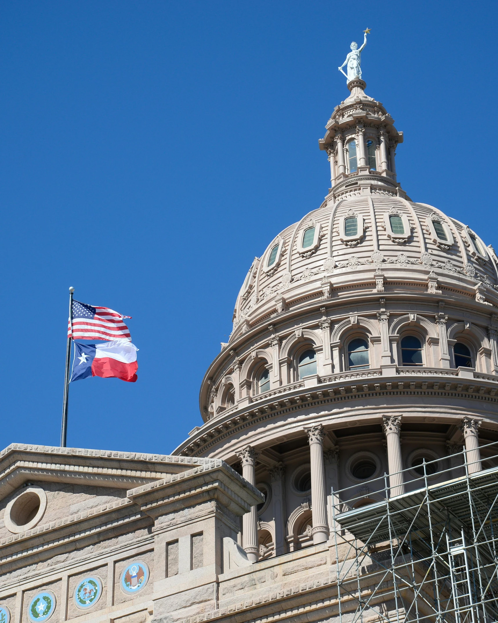 the flag is flying on top of the old building