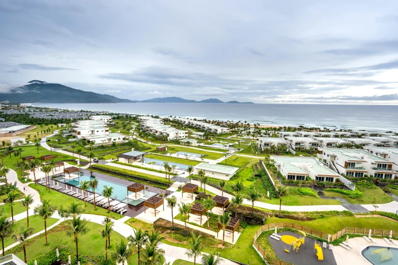 an aerial view of a tropical resort on the coast