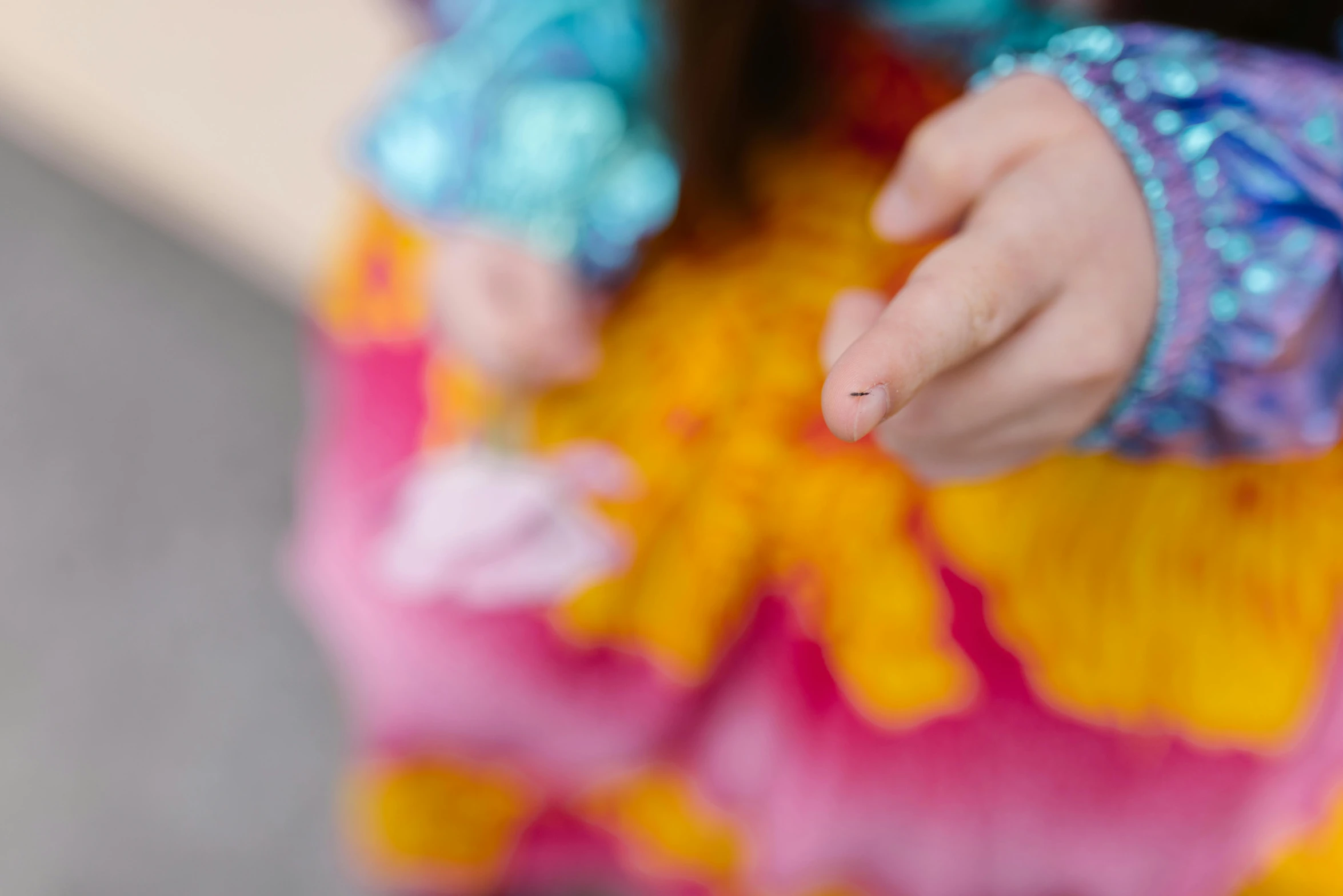 little girl making a gesture with her hand