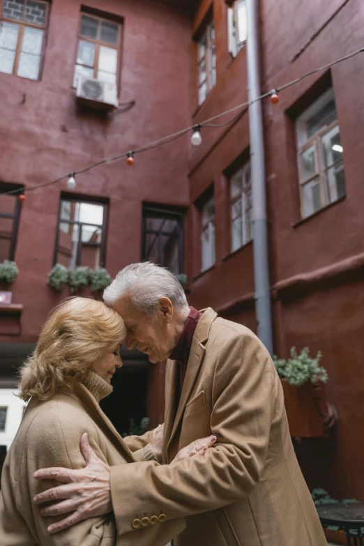 two people standing outside in the cold