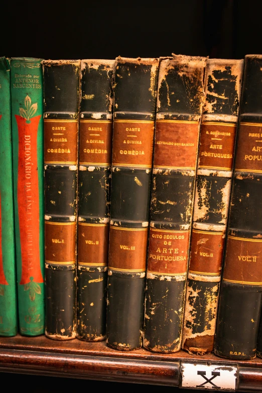 an old book shelf has old books on it