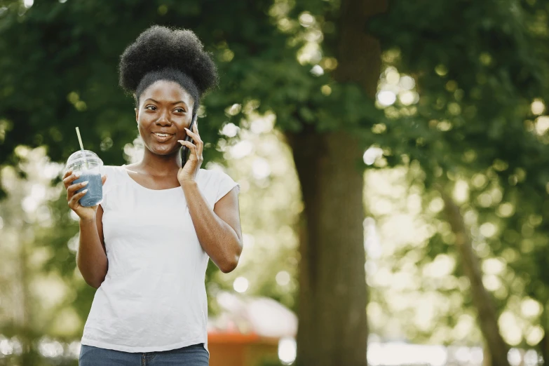 a black woman talks on a cell phone