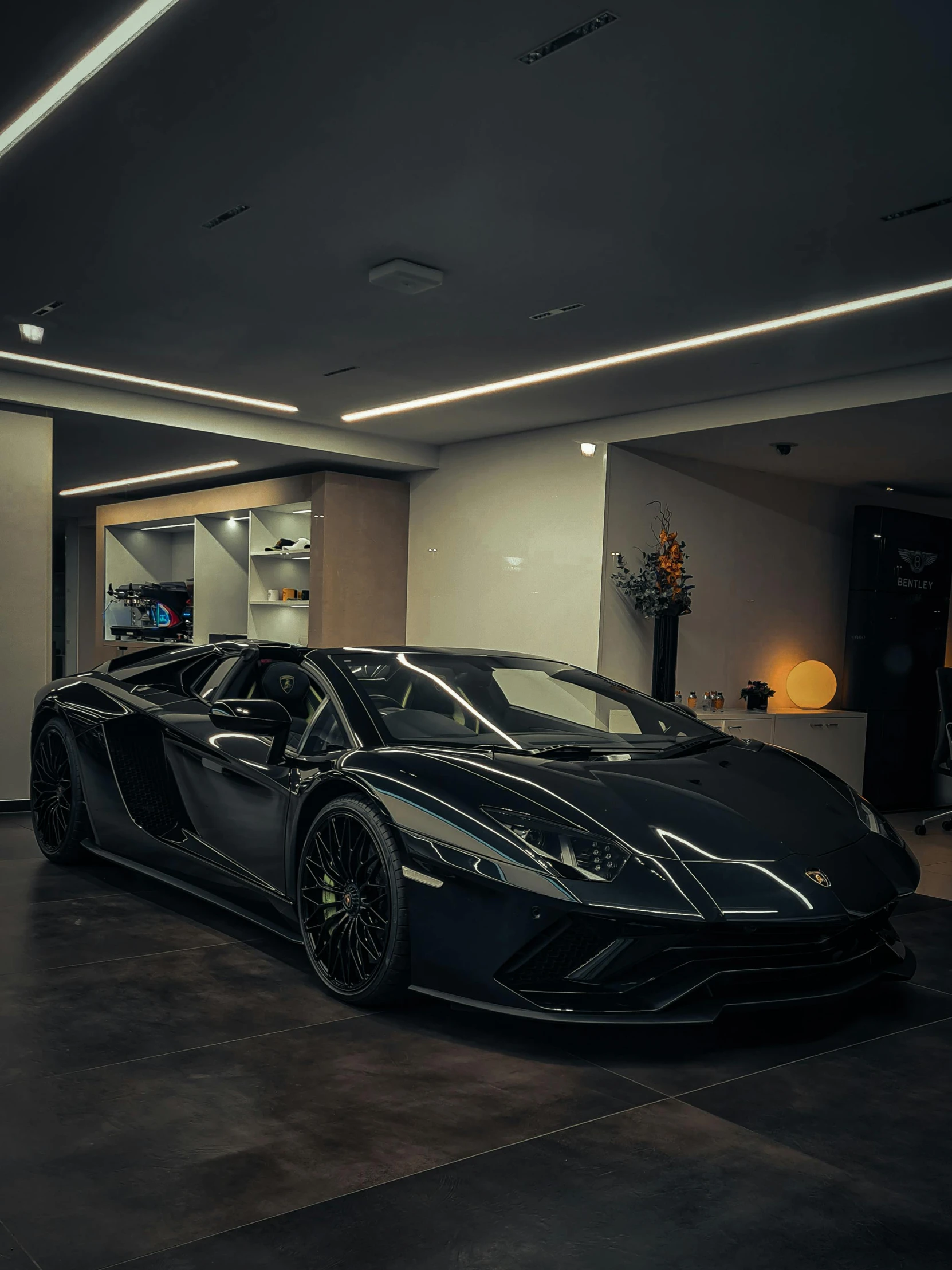 a black, sleek car parked in a room
