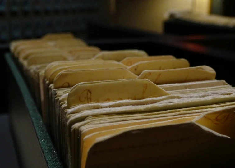 an image of yellow papers on shelf with room in background