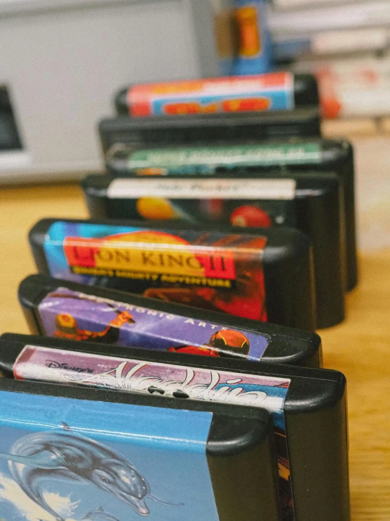 small toy cars lined up on a wooden table