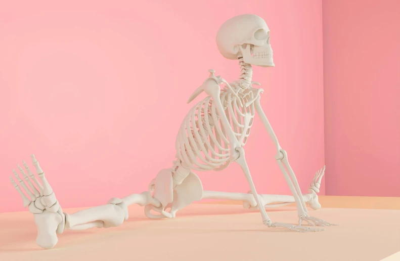 a plastic skeleton with two hands on one leg
