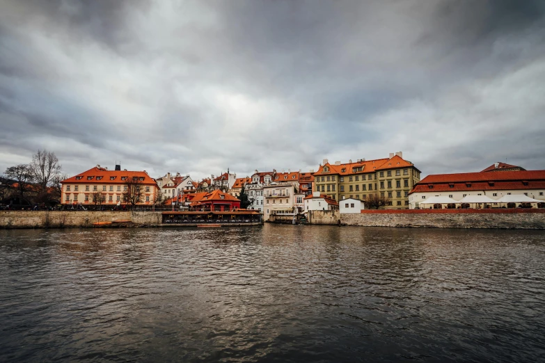 a large body of water with buildings near by