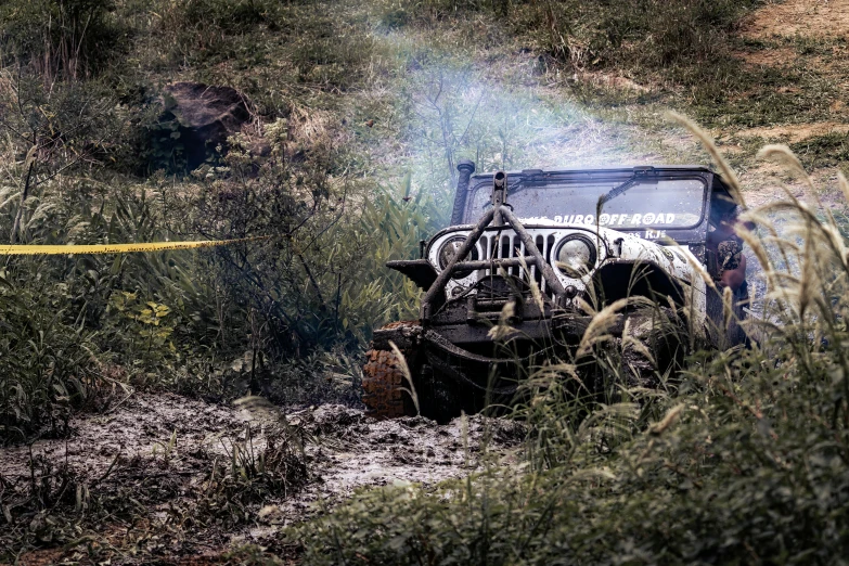 a jeep that has been stuck in the mud