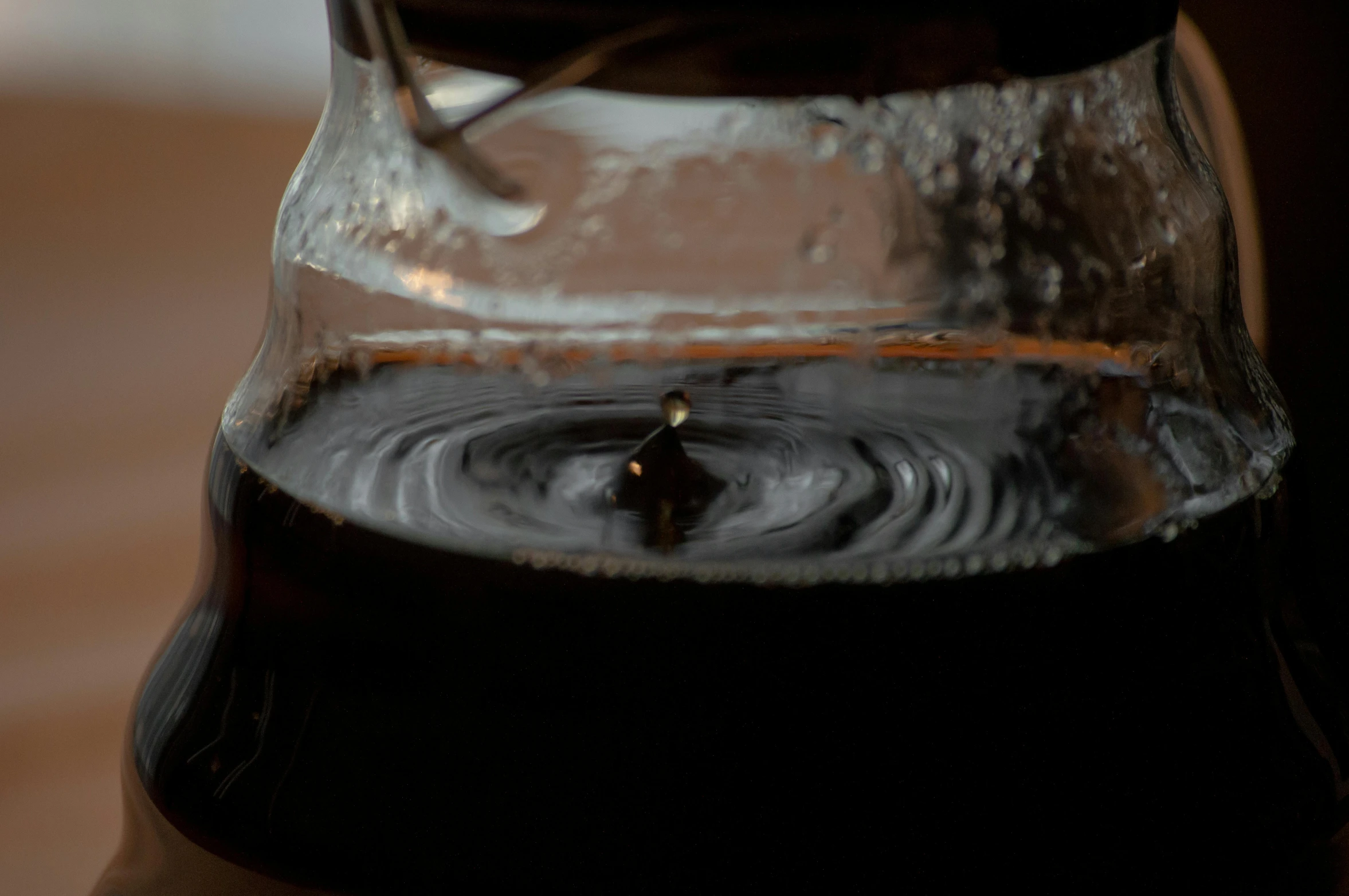 there is water inside of a jug that has liquid on the bottom