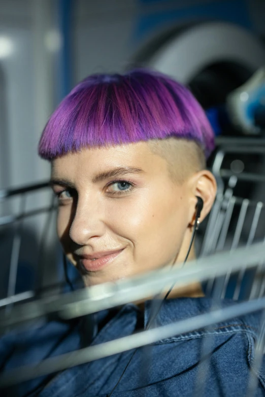 a woman with purple hair and earphones