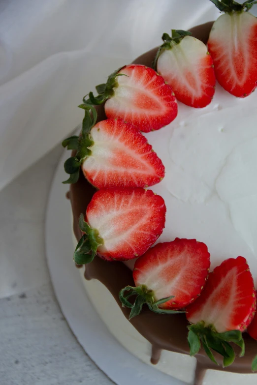 a close up of a cake with strawberries in the middle