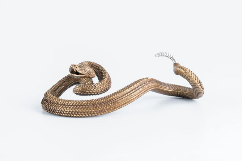 two metallic snakes in the middle of one with their mouths open