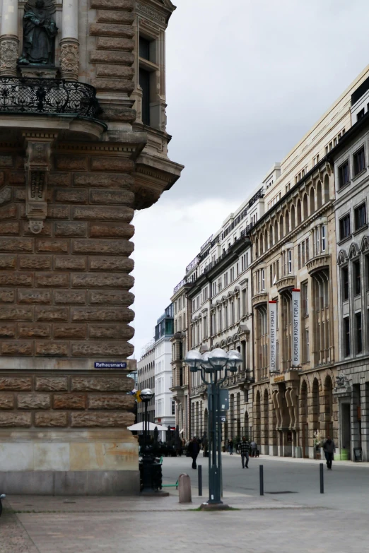 a clock is in the middle of the streets