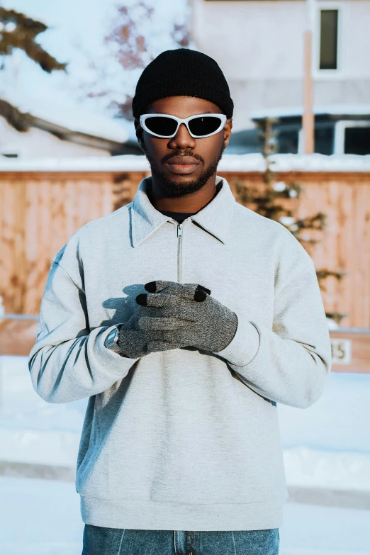 the man in glasses holds a bird on his hands