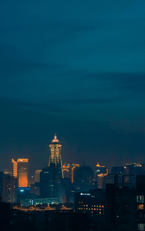 an airplane flying through the night sky over a city