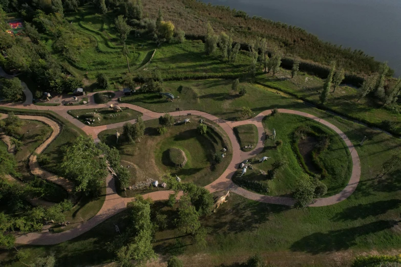 a park that includes circular seating and a large body of water