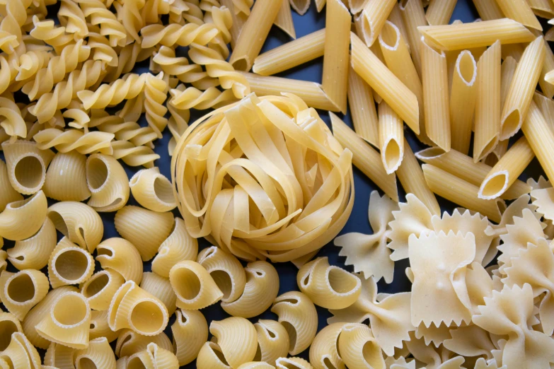 some types of pasta with a yellow broccoli sprout