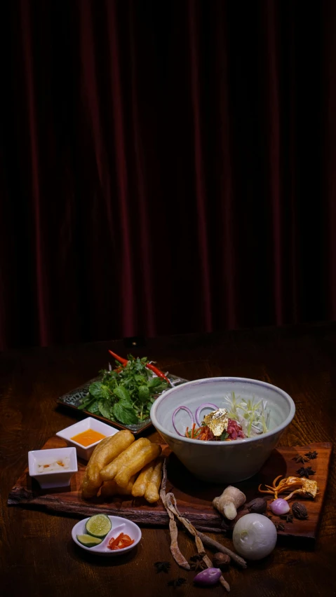 a bowl of food sitting on top of a wooden table