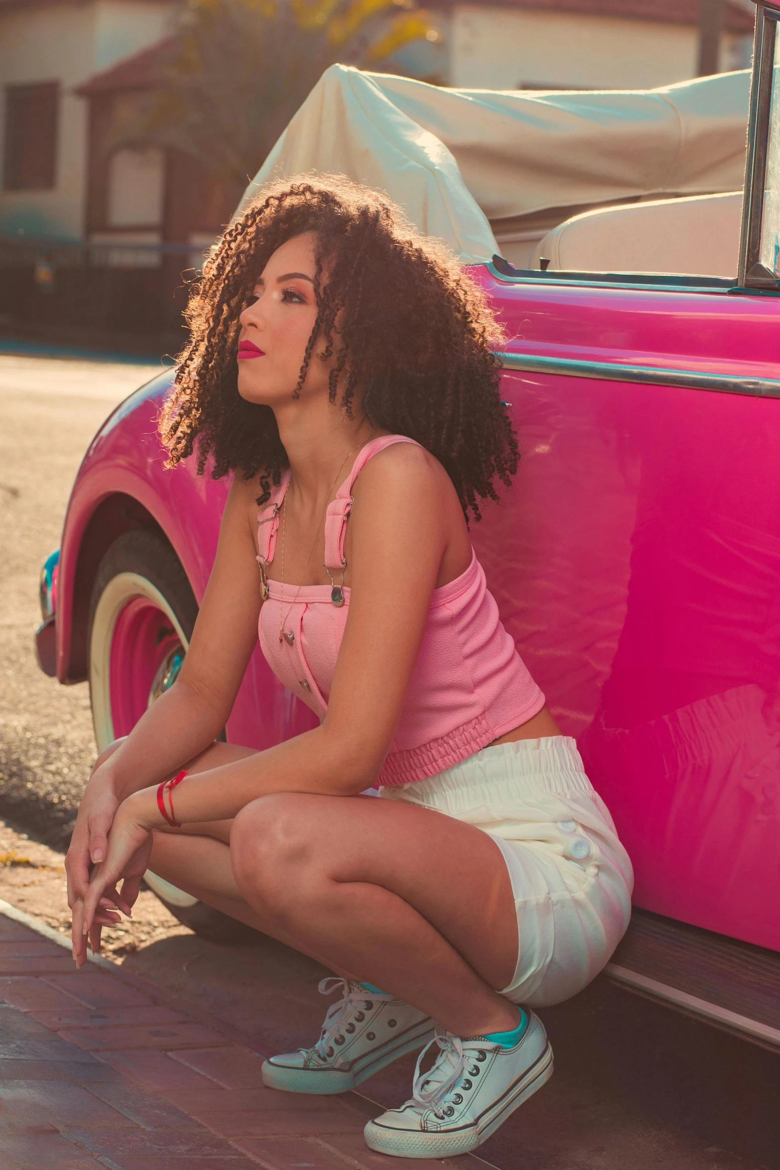 a girl with a bright pink shirt and a white skirt