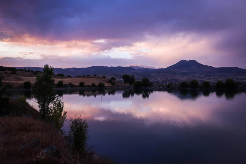 a large body of water under a cloudy sky