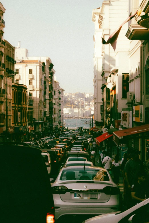 cars are lined up on the side of a road